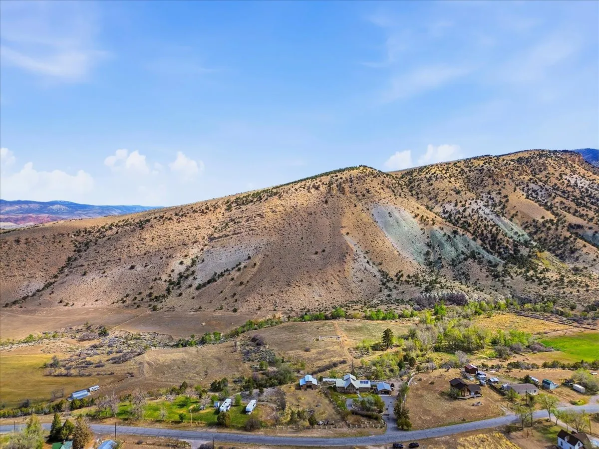 Expansive mountain landscape featuring varied terrain and natural vegetation