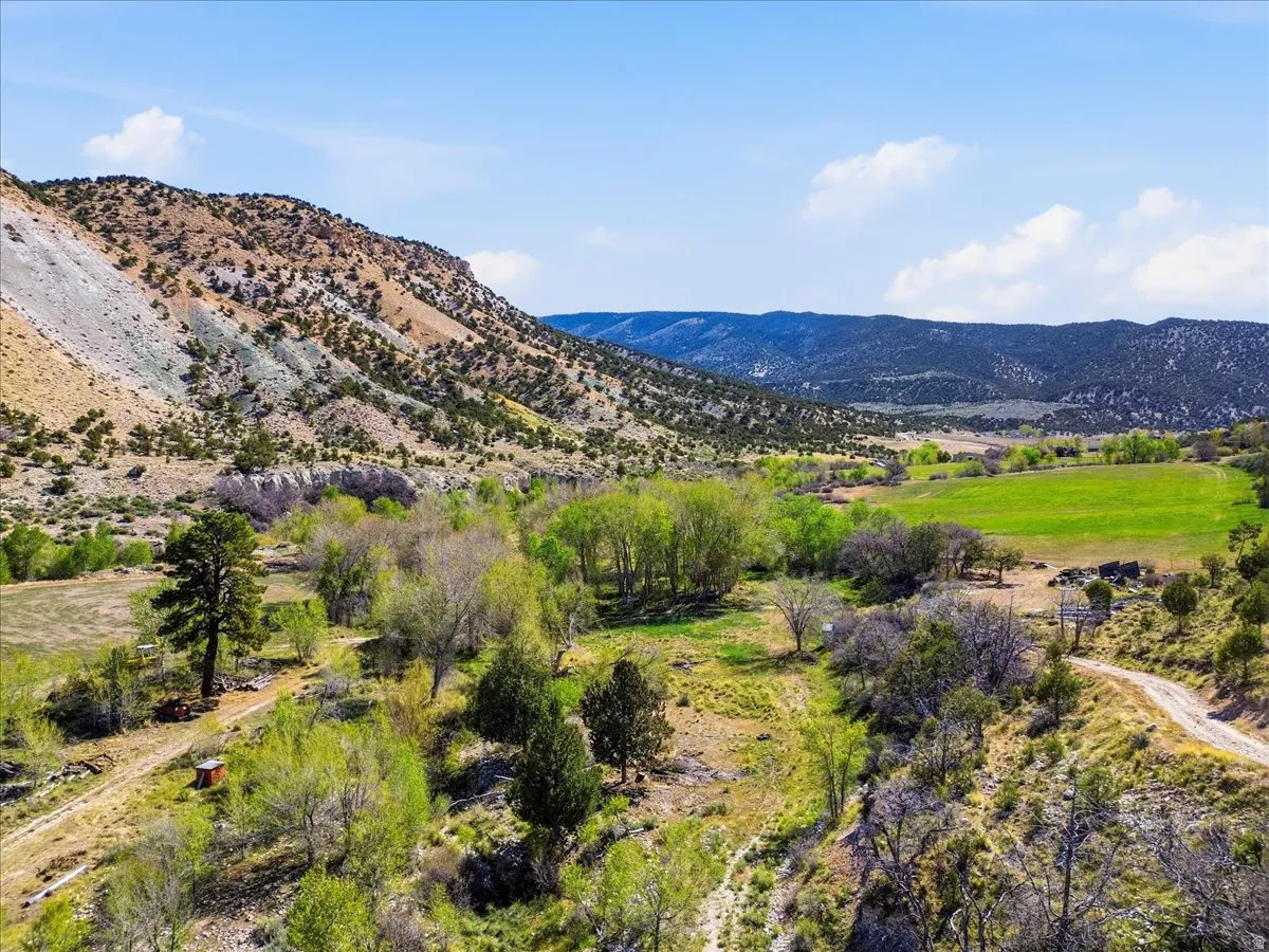 Expansive natural landscape featuring rolling hills and varied topography