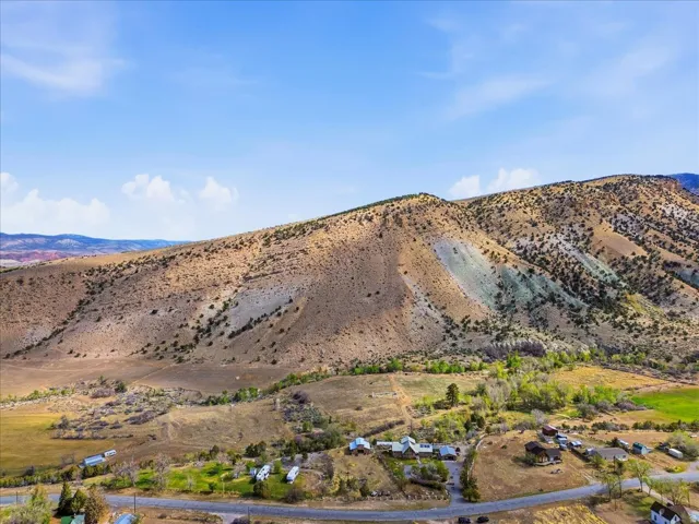 Expansive mountain landscape featuring varied terrain and natural vegetation