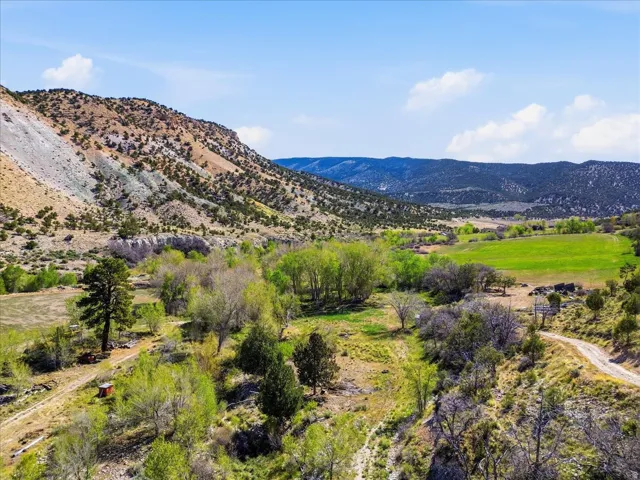 Expansive natural landscape featuring rolling hills and varied topography