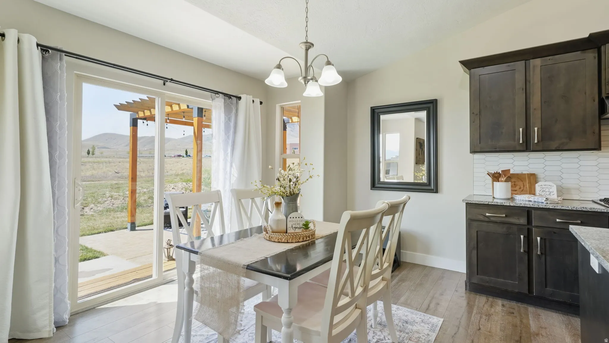Dining area featuring wood-finish flooring, and patio access
