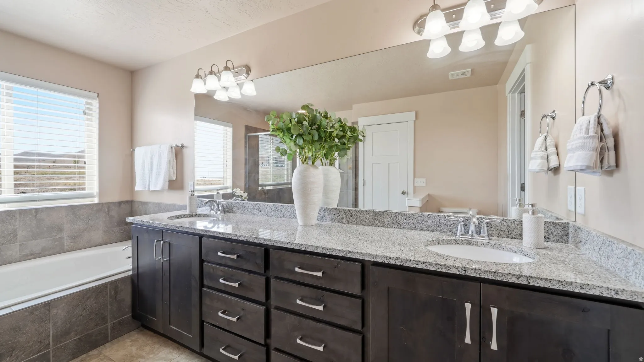 Dual vanity with granite countertop and undermount sinks