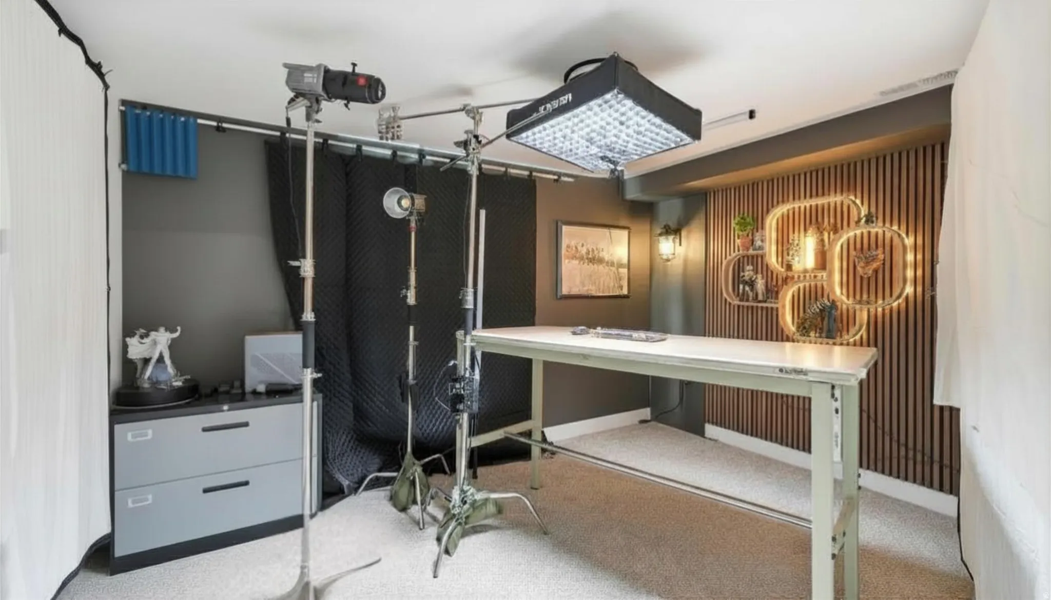 Dedicated workspace featuring textured wall paneling for recording studio/bedroom