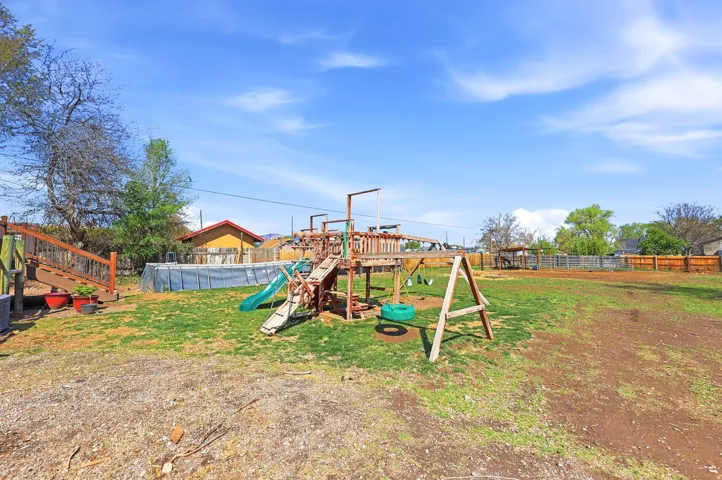 View of play area featuring an outdoor pool