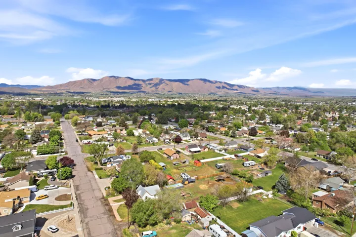 Aerial perspective of suburban area with a mountain backdrop