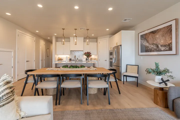 Open-concept living area with wood-finish flooring