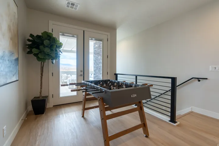 Light wood-finish flooring complements the neutral wall tones