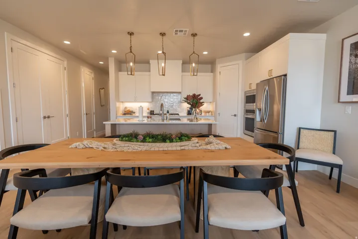 Open-concept dining area featuring wood-finish flooring