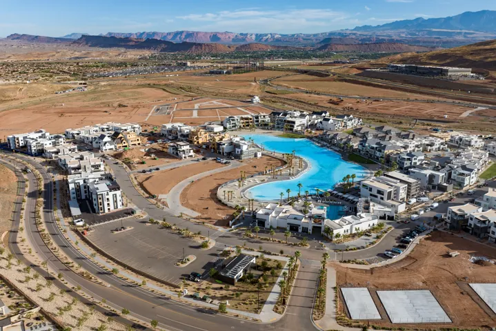 Community featuring a large recreational lagoon, a collection of modern architectural residences, and expansive undeveloped parcels