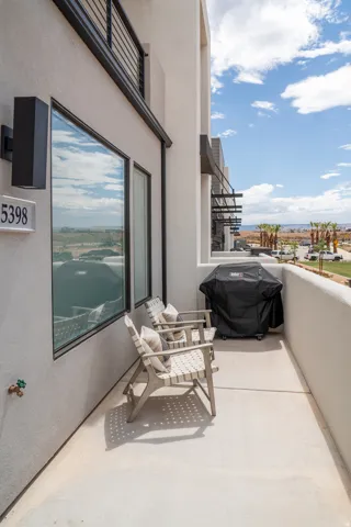 Private outdoor patio featuring light-colored concrete flooring