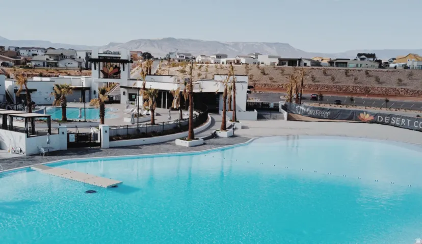 Expansive lagoon-style pool featuring a floating dock structure