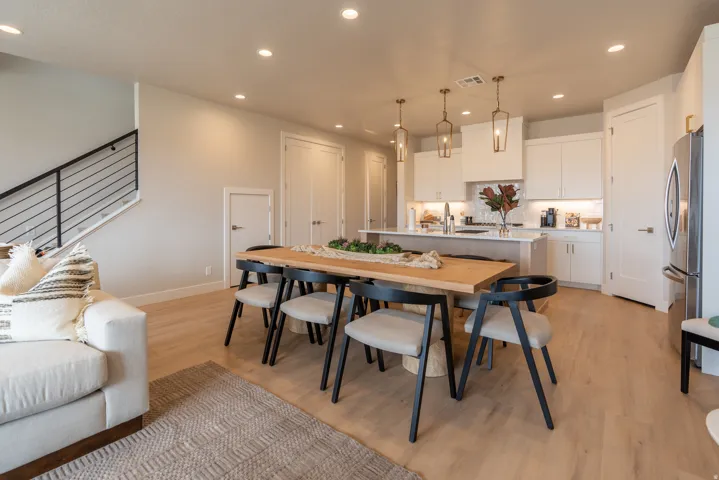 Open-concept living space with light wood-finish flooring