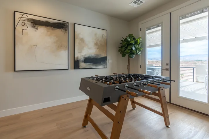 Light-toned wood-finish flooring complements neutral wall tones