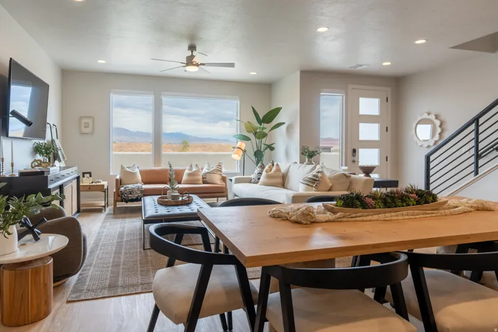 Open-concept living space featuring wood-finish flooring, recessed lighting, and a contemporary ceiling fan