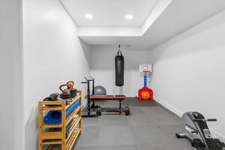 Dedicated room featuring recessed lighting, a drop ceiling, and a clean white color palette