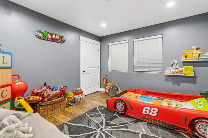 Room with gray walls and wood-finish flooring