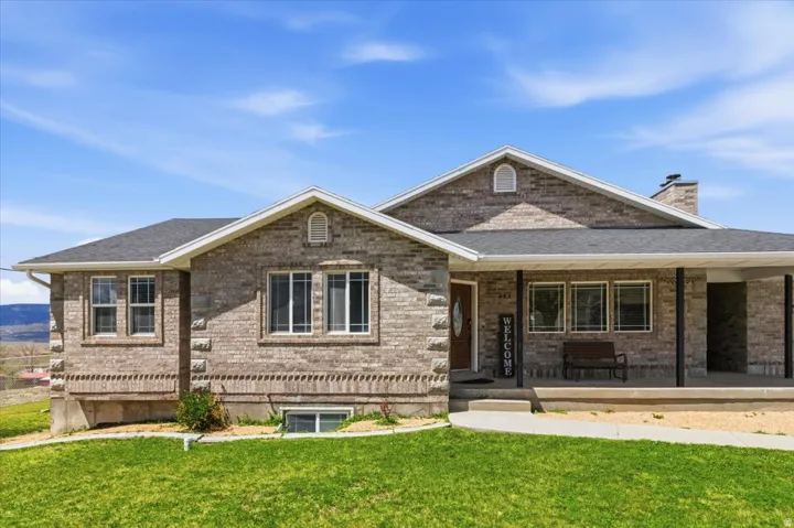 Brick exterior featuring multiple window styles