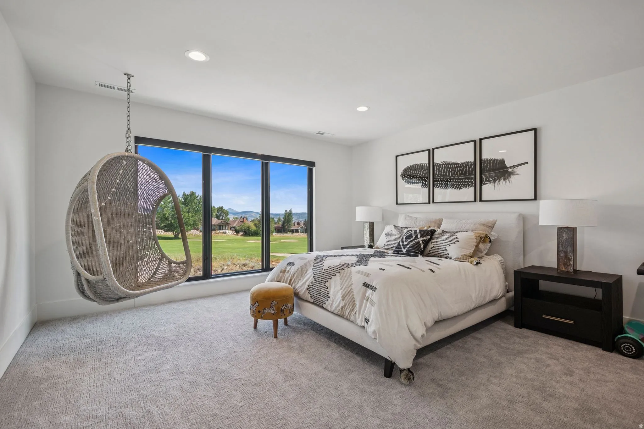 Second extra large primary suite with floor to ceiling windows overlooking golf course and views of the Wasatch range.