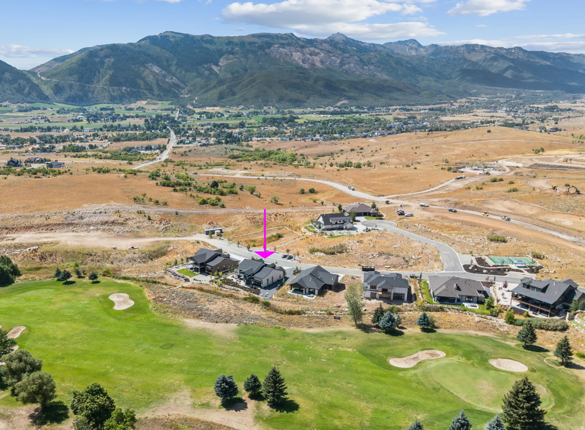 Golf course property on 15th fairway featuring a mountain backdrop and surrounding landscape.