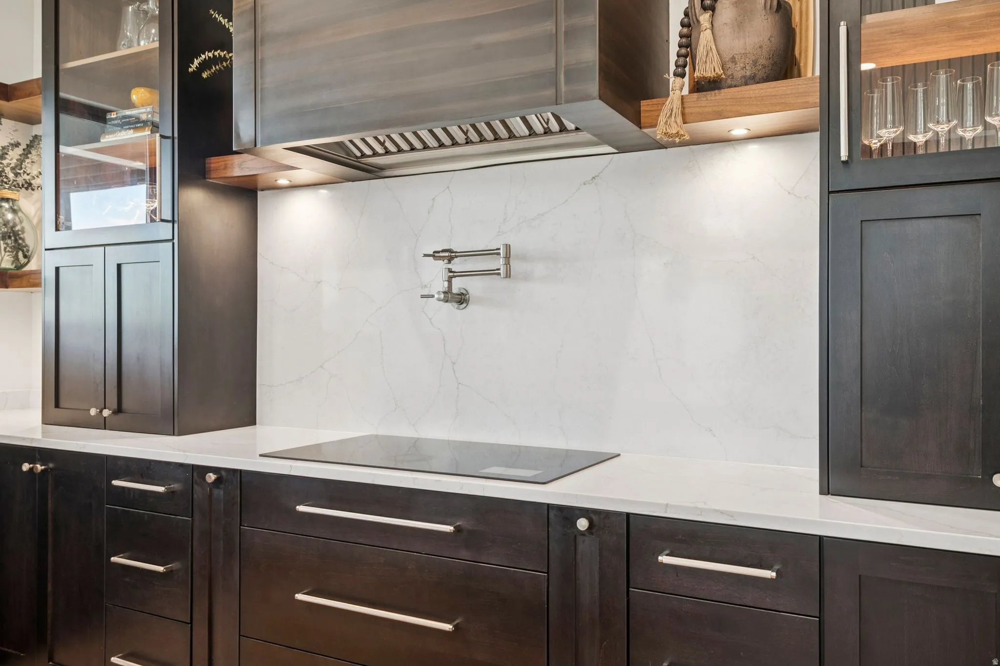 Custom metal hood, Wolf induction cook top, industrial stove vent, and pot filler.