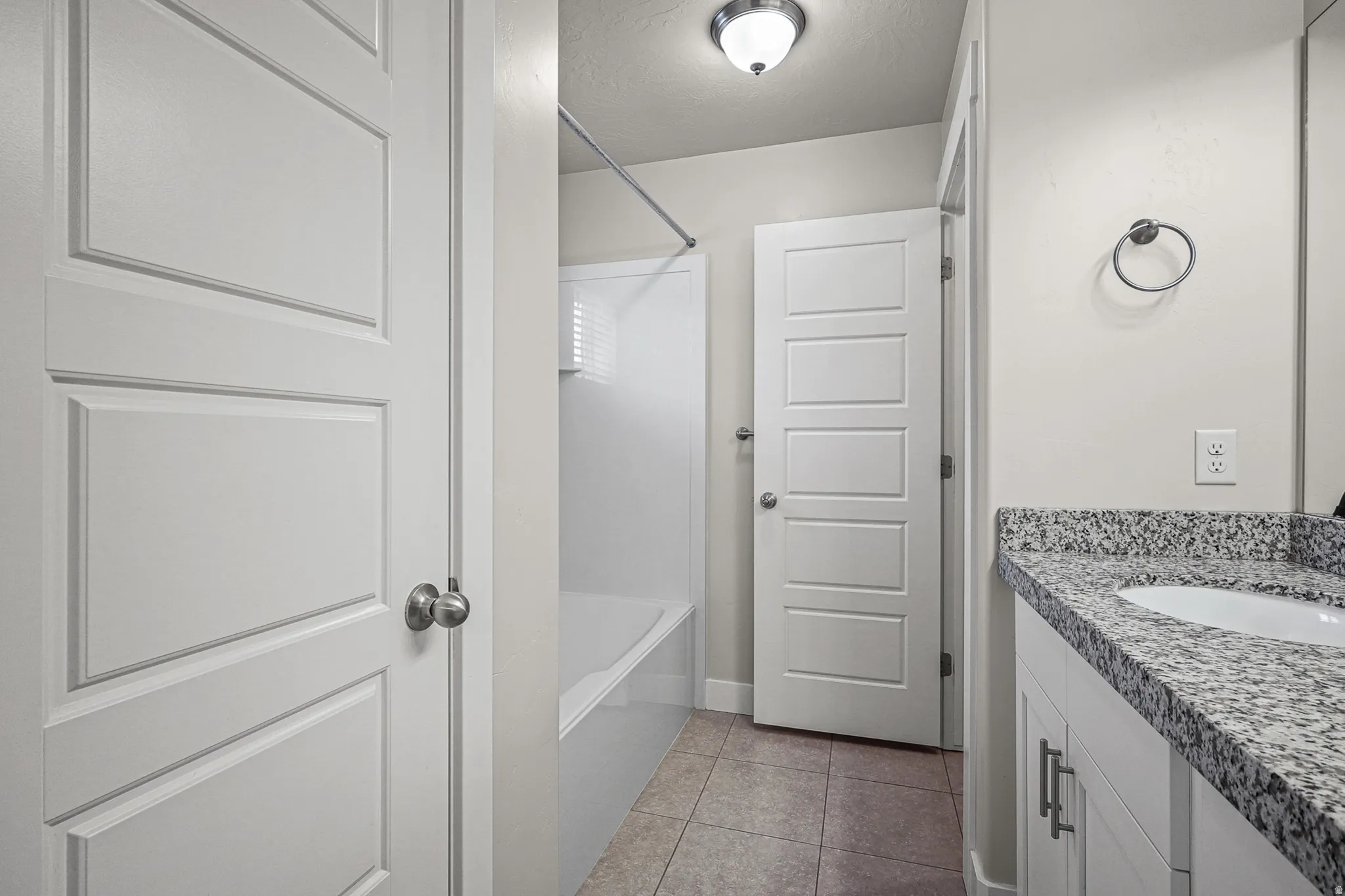 Primary bathroom feat. Shower/tub and water closet.