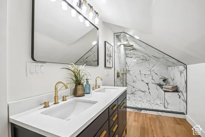 Dual vanity with integrated rectangular sinks and brass-finish fixtures