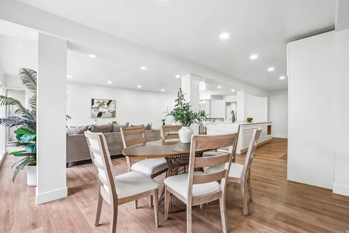 Open-concept living space with wood-finish flooring throughout