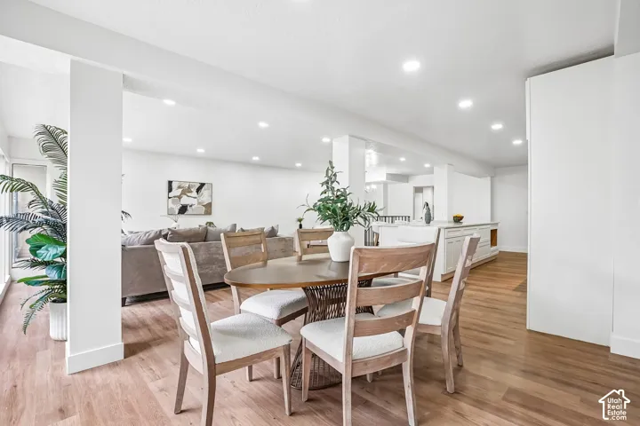 Open-concept living space with wood-finish flooring throughout