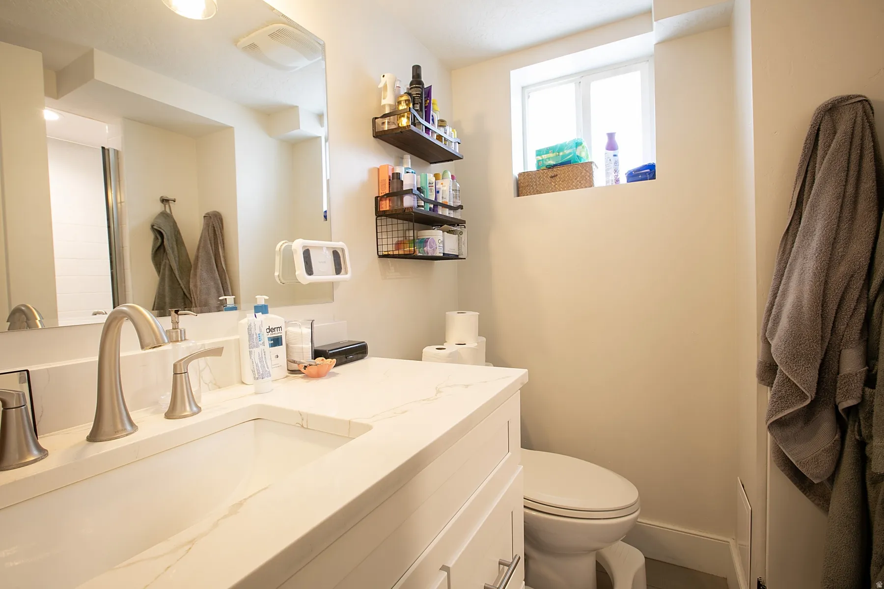 Half bathroom with toilet and vanity