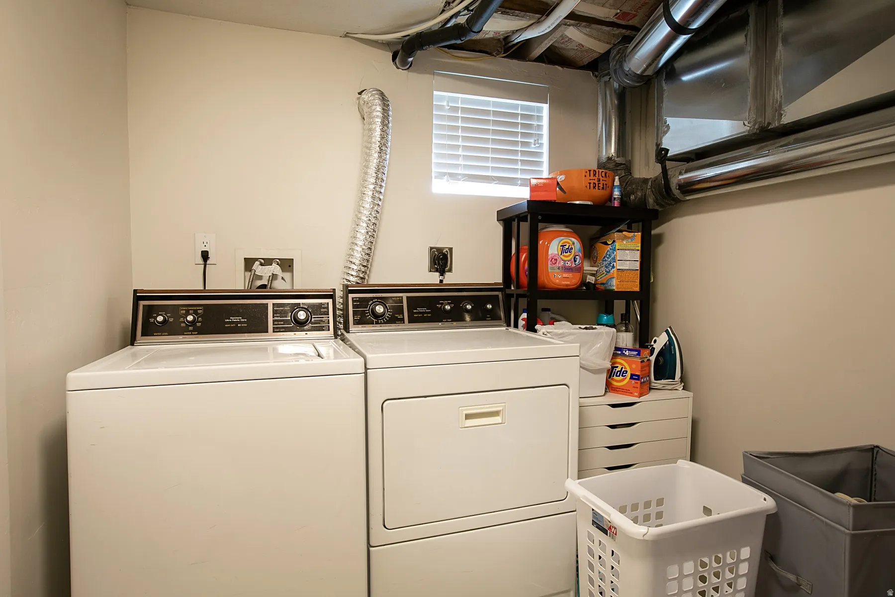 Laundry room featuring washing machine and clothes dryer