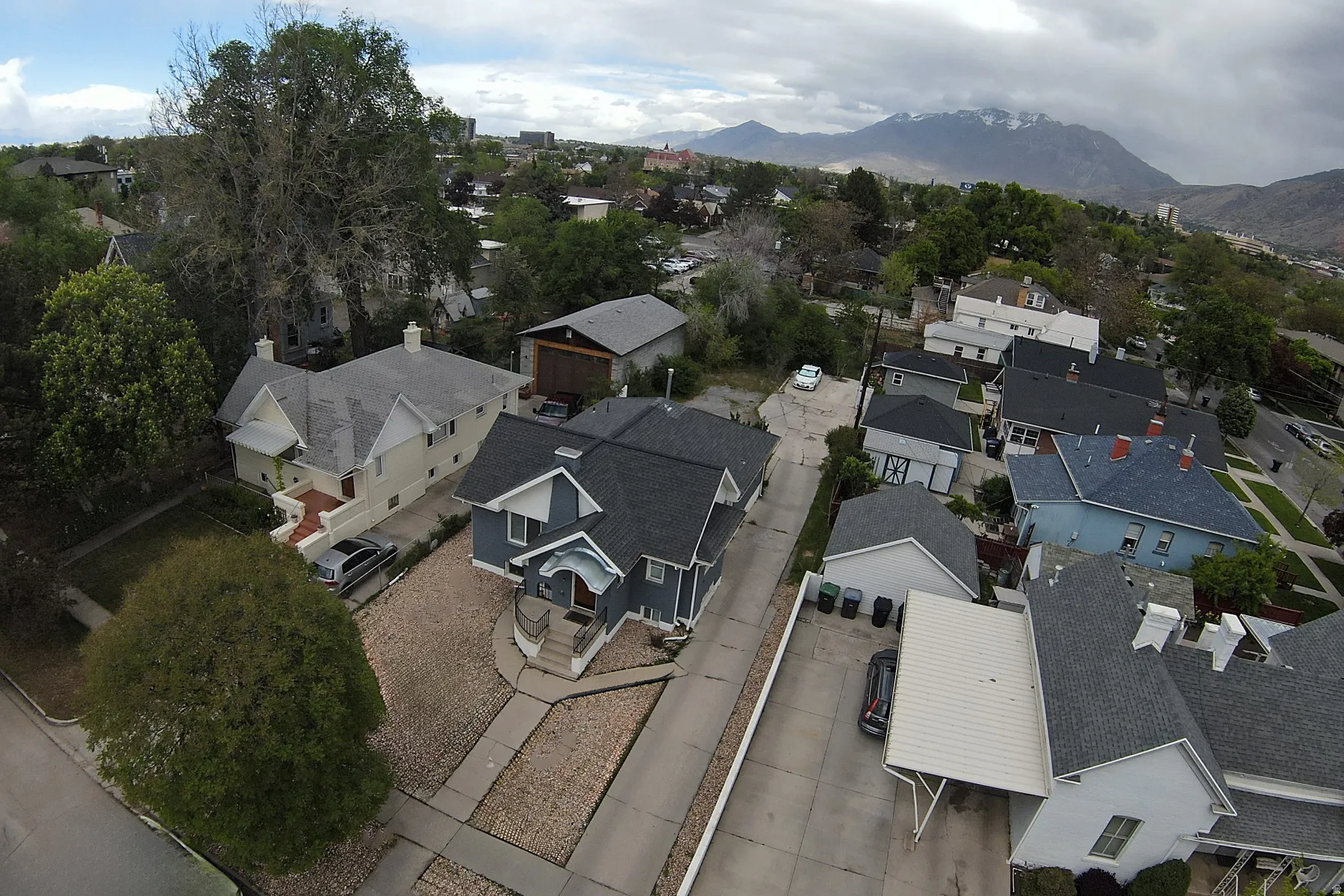 Aerial view of residential area featuring a mountainous background