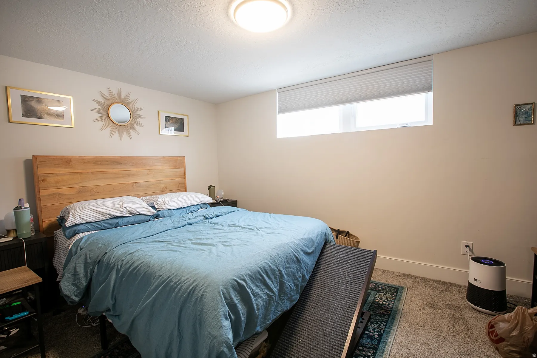 Carpeted bedroom with a textured ceiling