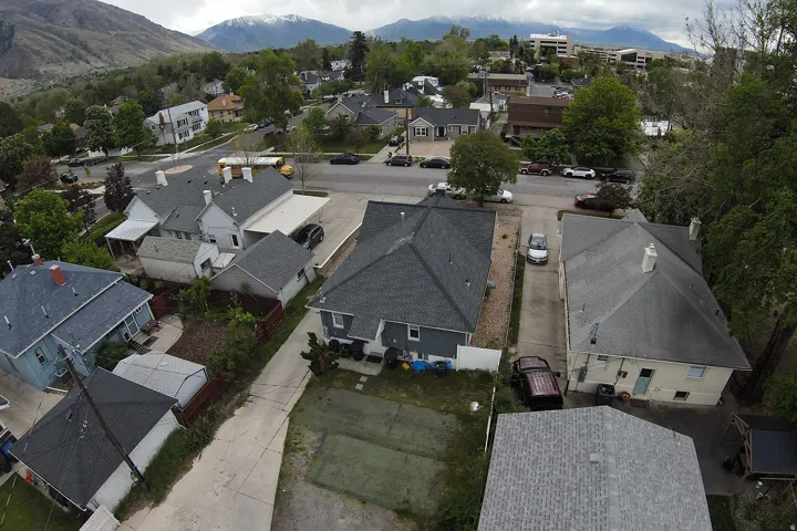 Aerial perspective of suburban area featuring mountains