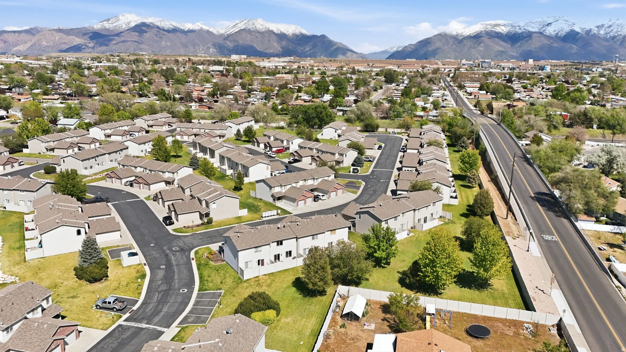 View of property location with mountains and nearby suburban area