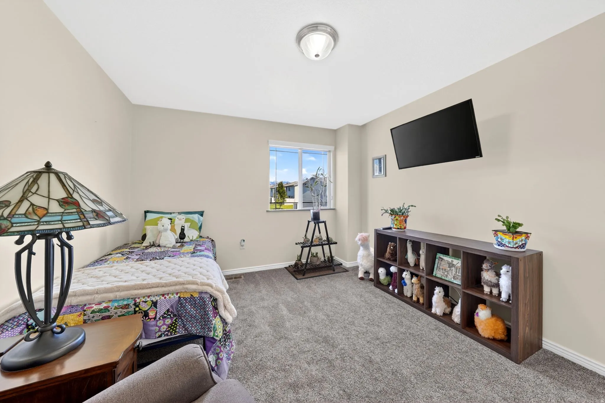 Bedroom featuring carpet floors and baseboards