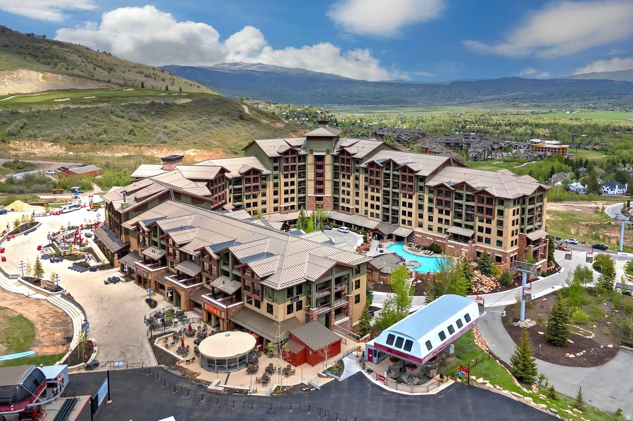 Expansive resort-style complex featuring multi-story buildings with varied architectural rooflines and exterior finishes