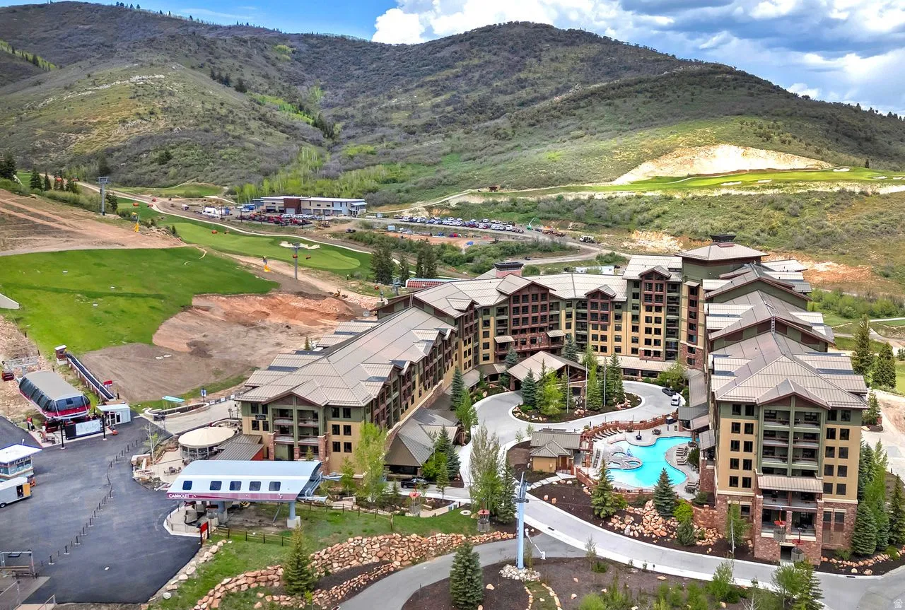 Expansive multi-story property featuring a tiered design with multiple balconies