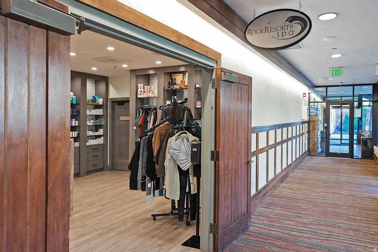 Spa entry with wood-finish flooring and recessed lighting