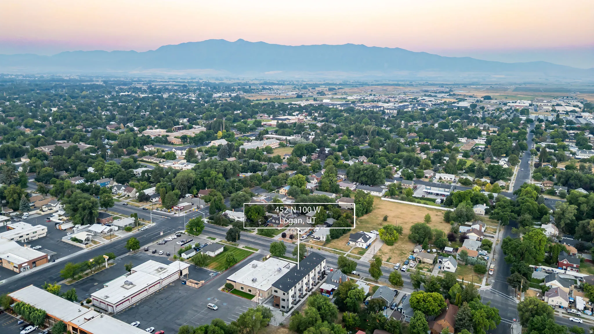 Aerial perspective of a residential area with varied housing styles and mature tree coverage