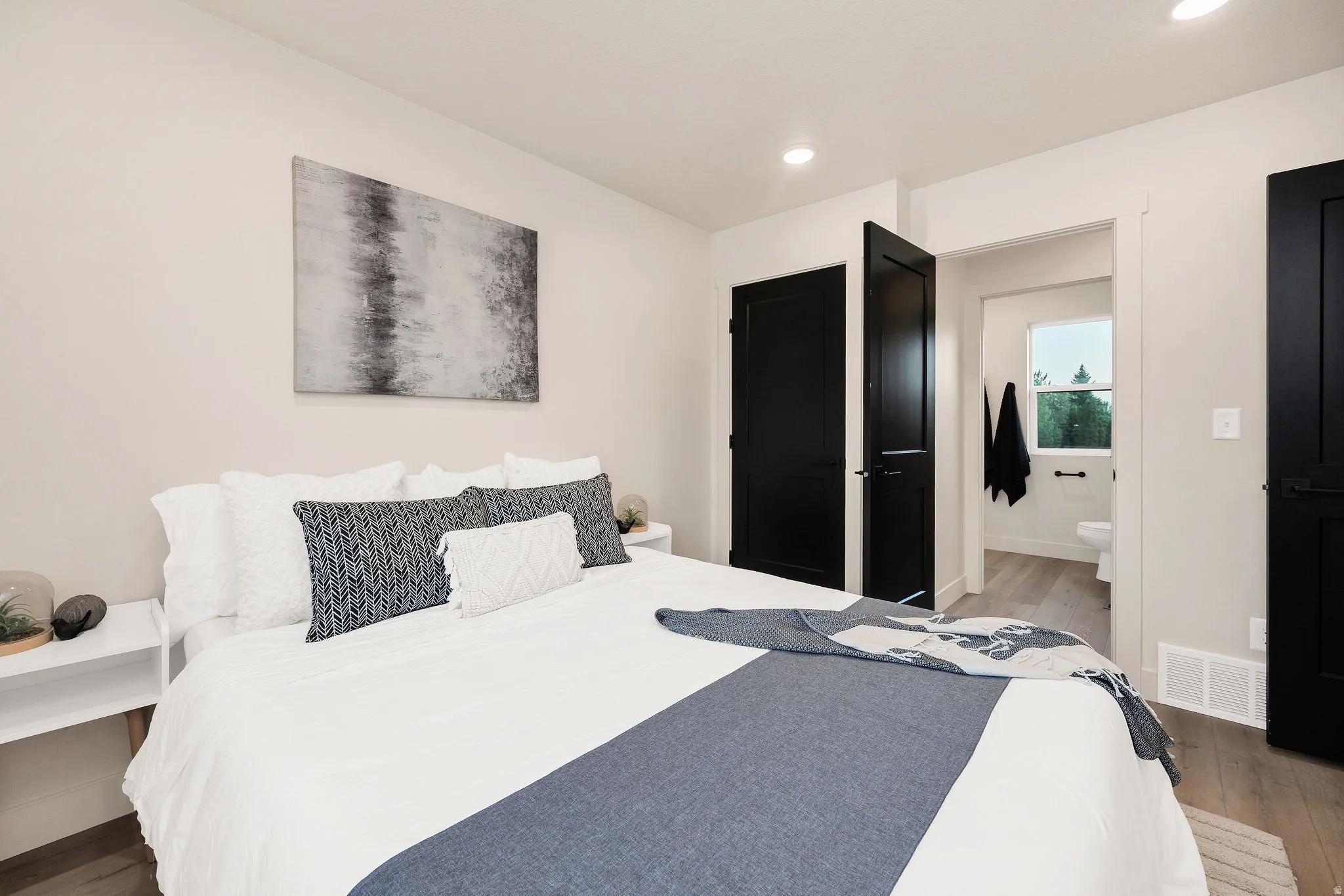 Bedroom featuring recessed lighting, dark wood-finish flooring, and light-toned walls