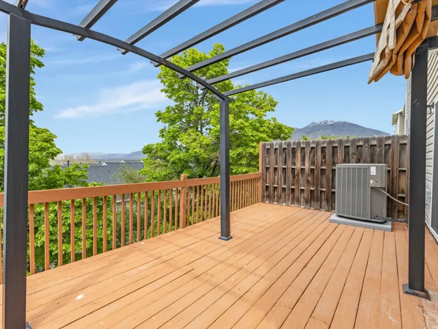 Expansive outdoor deck featuring wood flooring and a perimeter railing
