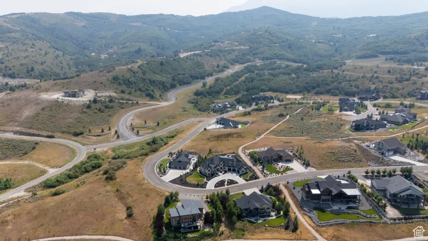 Aerial perspective showcasing a residential development carved into a mountainous landscape