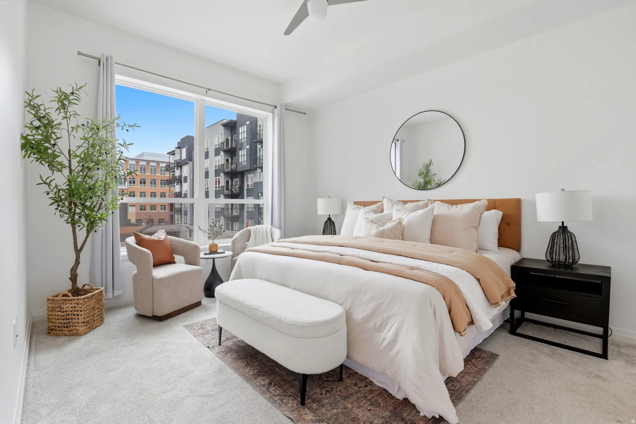 Expansive bedroom featuring wall-to-wall carpeting and a large window