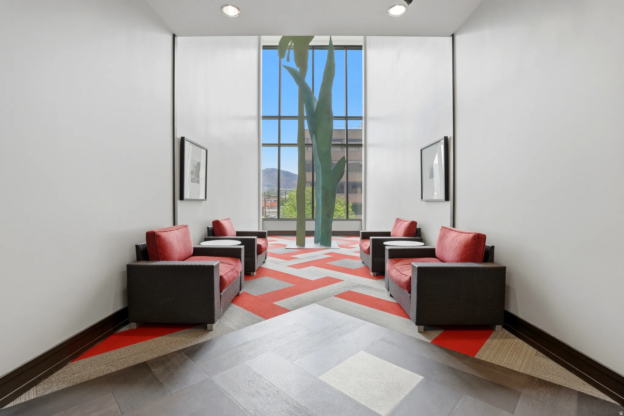 Foyer featuring a two-story window, recessed lighting, and wood-finish flooring