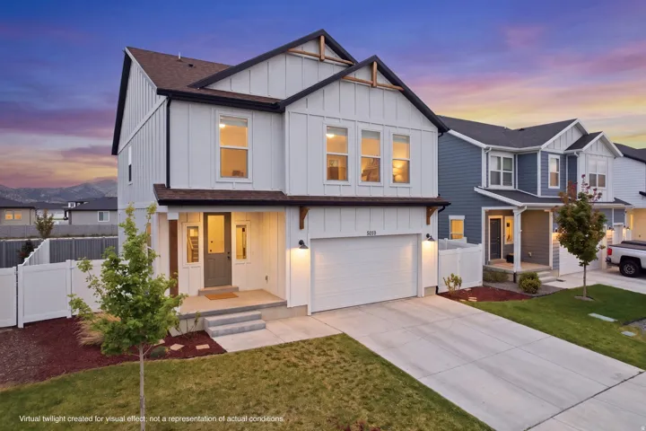 Modern two-story residence featuring white board-and-batten siding with dark trim accents