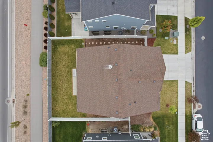 Brown shingle roof with multiple vents and a chimney