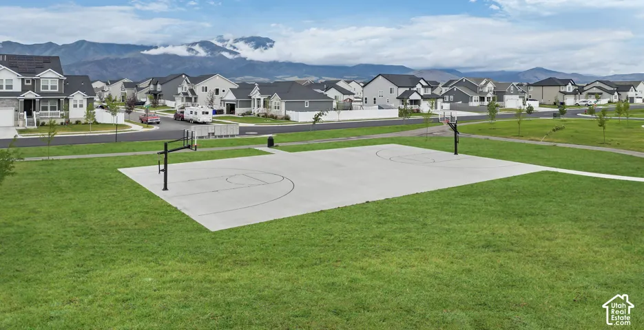 Community basketball court with a concrete surface and two hoops