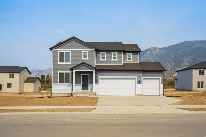 **DISCLAIMER** Elevation may vary. Contemporary two-story residence with a gray and white exterior