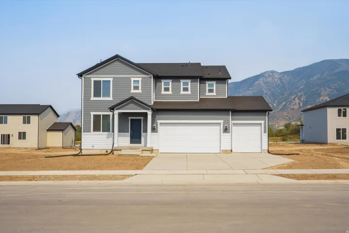 **DISCLAIMER** Elevation may vary. Two-story residence featuring gray and white siding with a dark roof