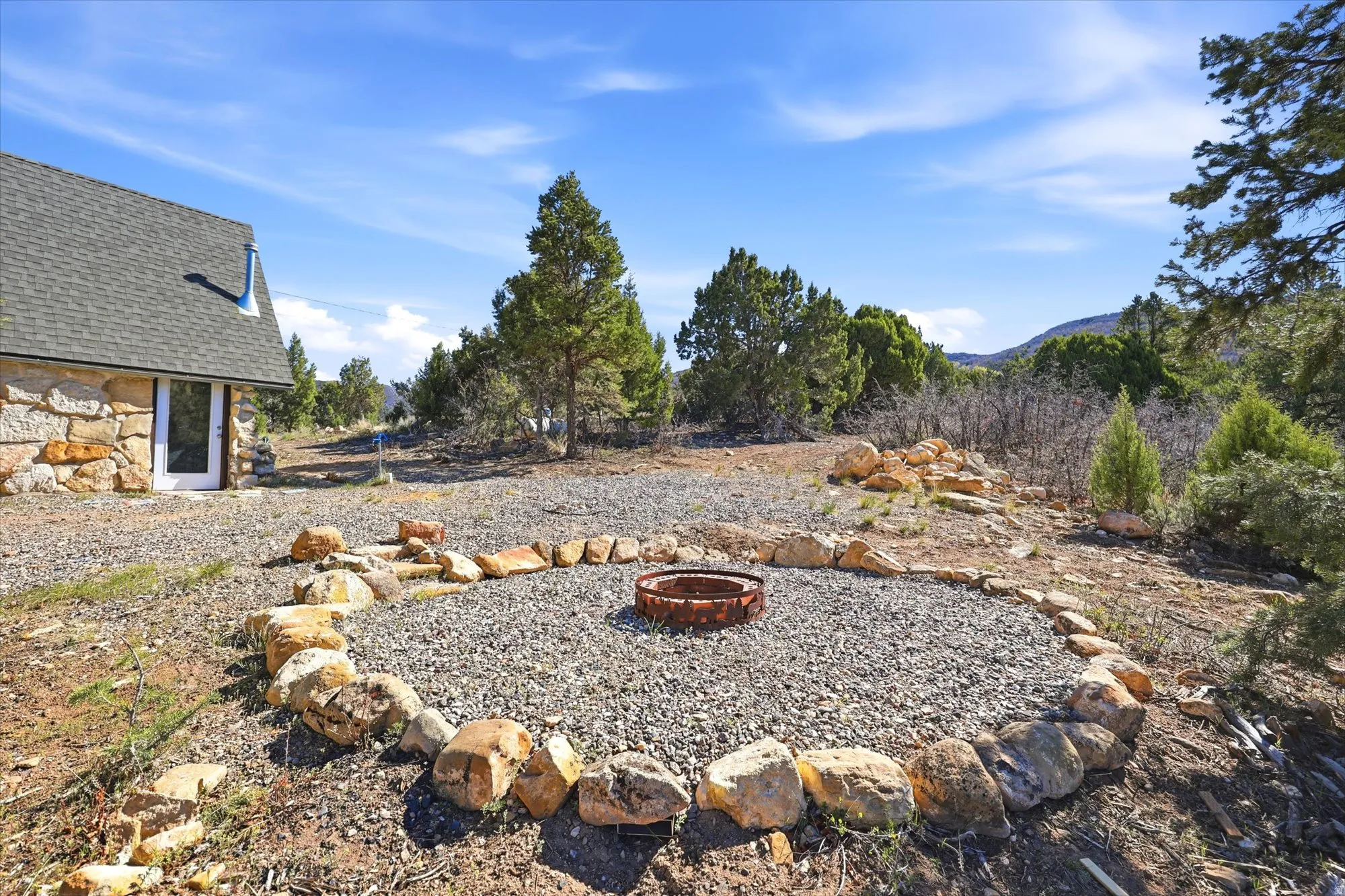 View of yard featuring an outdoor fire pit